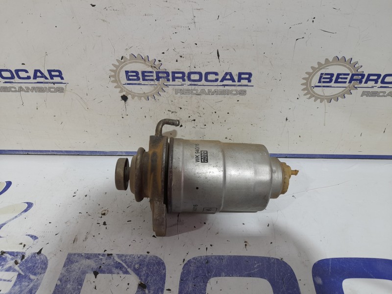 Recambio de soporte filtro gasoil para mitsubishi montero (l040) 2.5 turbodiesel referencia OEM IAM MB247423  