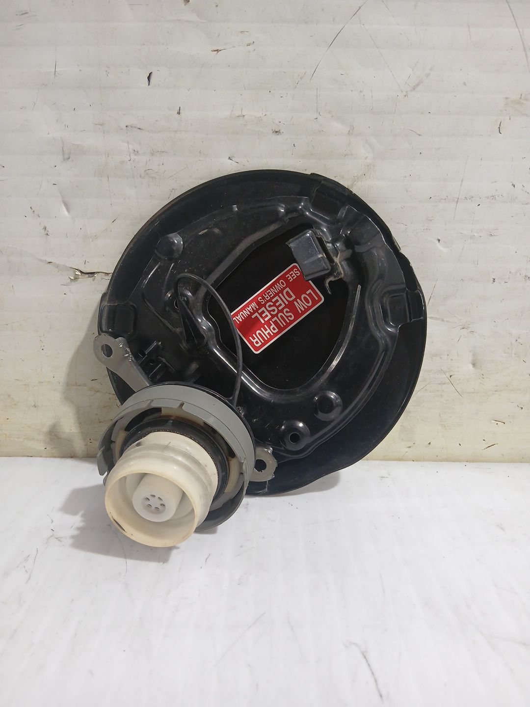 tapa_exterior_combustible_7735064010_toyota_corolla_verso_zer_zze12_r1_2_2_d_4d_aur10