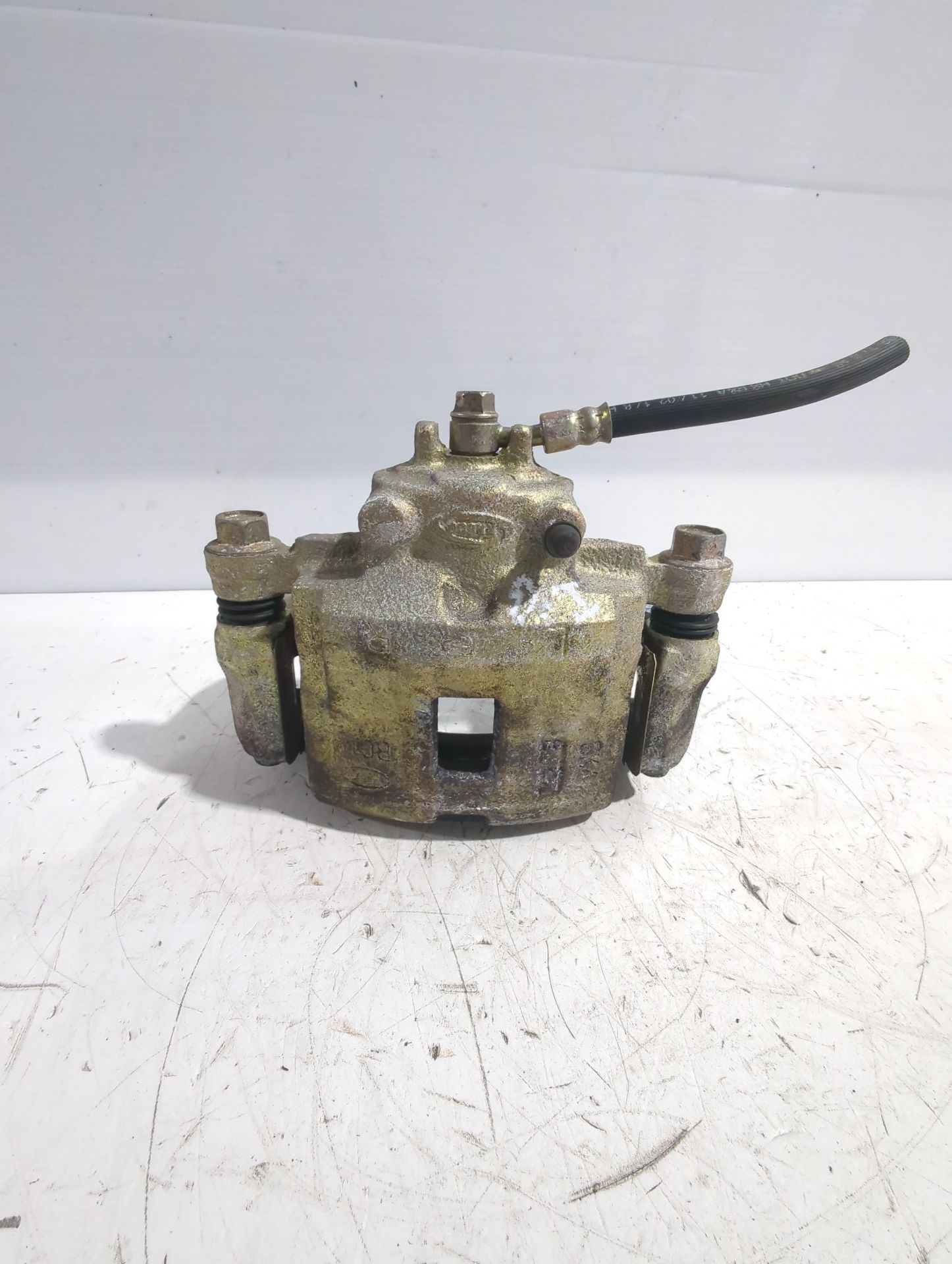 pinza_de_freno_delantera_izquierda_58110fdc00_kia_rio_i_sedan_dc_1_3